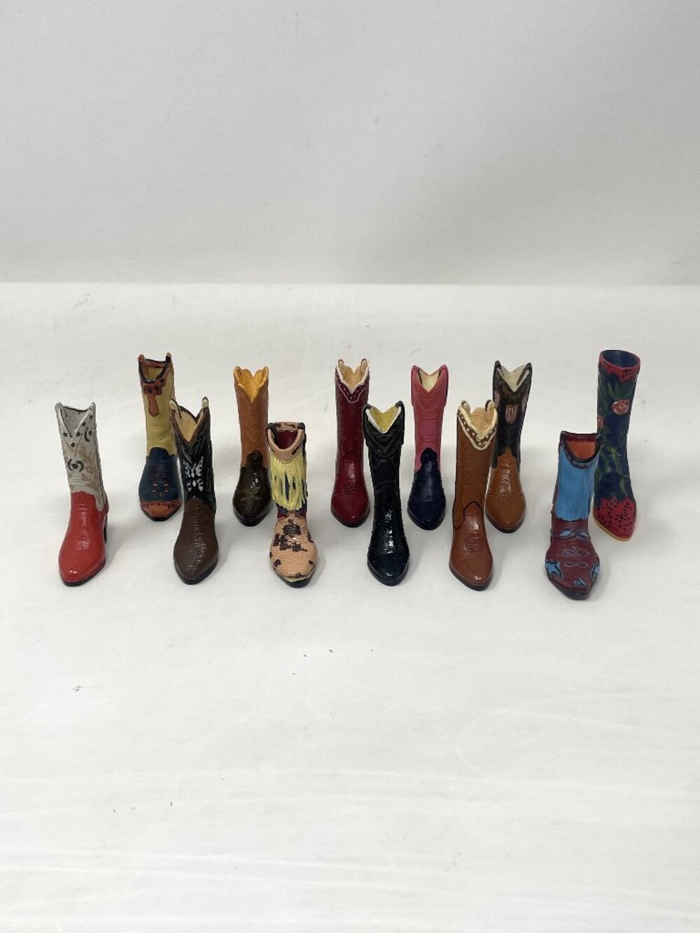 Collectible 12 Decorative, multicolored miniature cowboy boots figurines